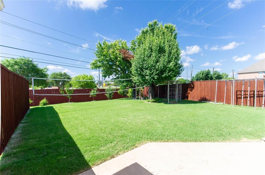 4136 Los Altos Drive Plano, TX 75024 - Photo 30 of 31 a view of a backyard with a garden and entertaining space