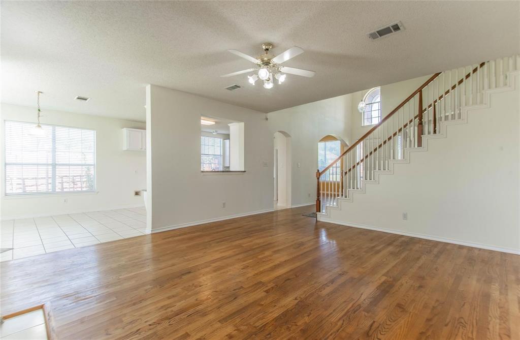 4136 Los Altos Drive Plano, TX 75024 - Photo 10 of 31 a view of an empty room with wooden floor and a window