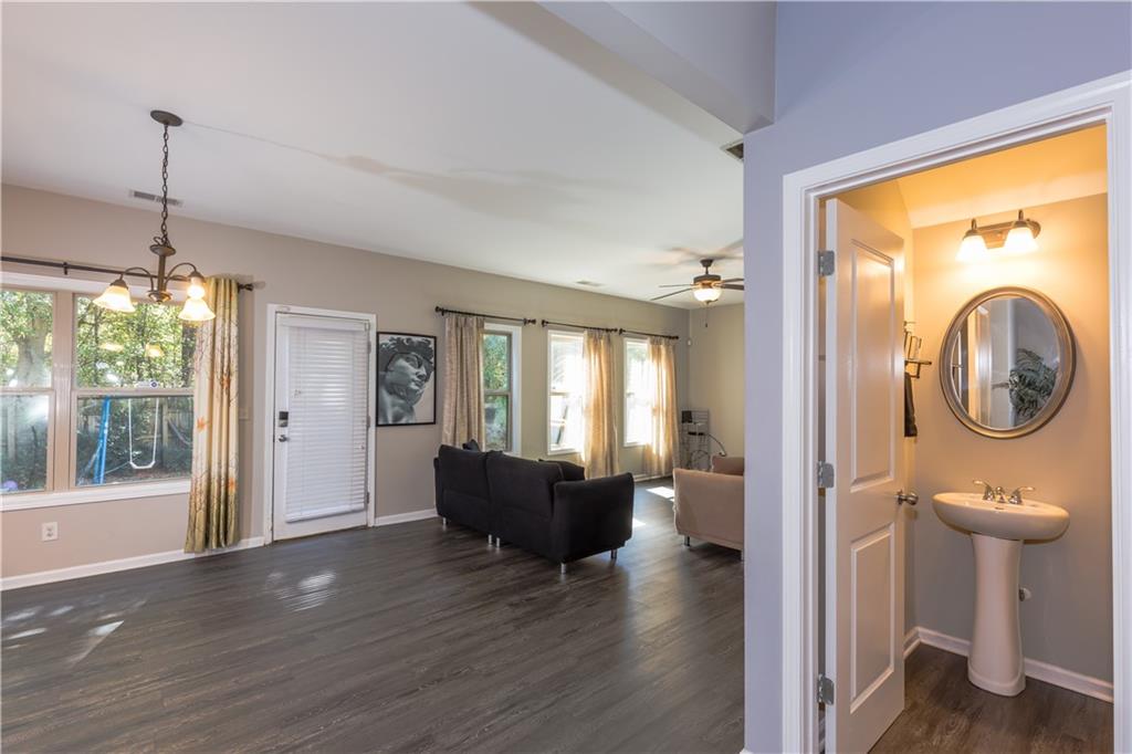 4245 Pear Haven Lane Gainesville, GA 30504 - Photo 11 of 39 a view of a livingroom with furniture wooden floor and windows