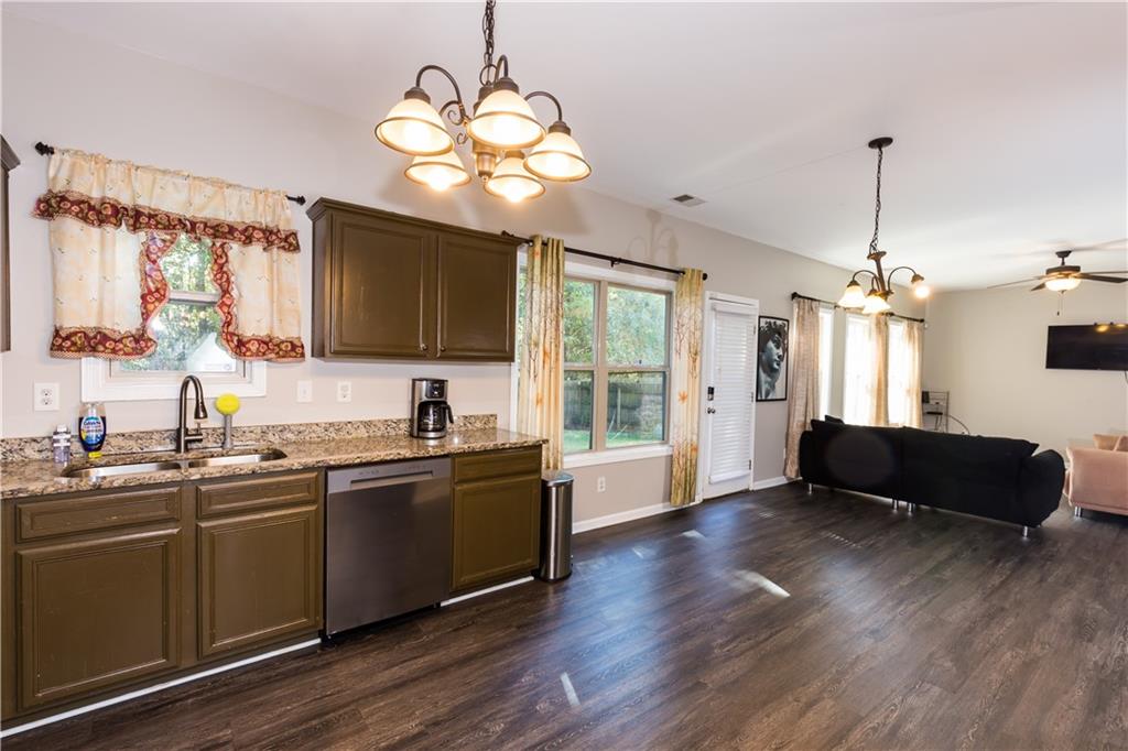 4245 Pear Haven Lane Gainesville, GA 30504 - Photo 15 of 39 a view of a kitchen sink and wooden floor