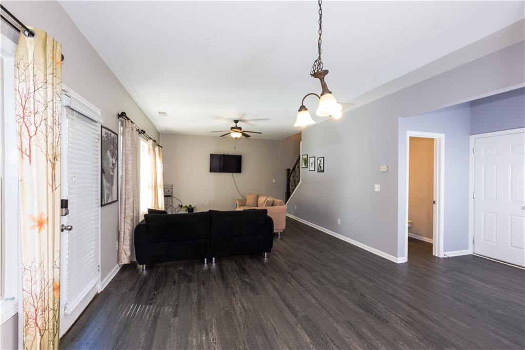 4245 Pear Haven Lane Gainesville, GA 30504 - Photo 19 of 39 a living room with furniture and a chandelier