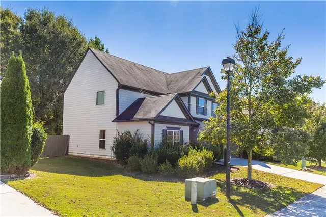 a front view of a house with a yard