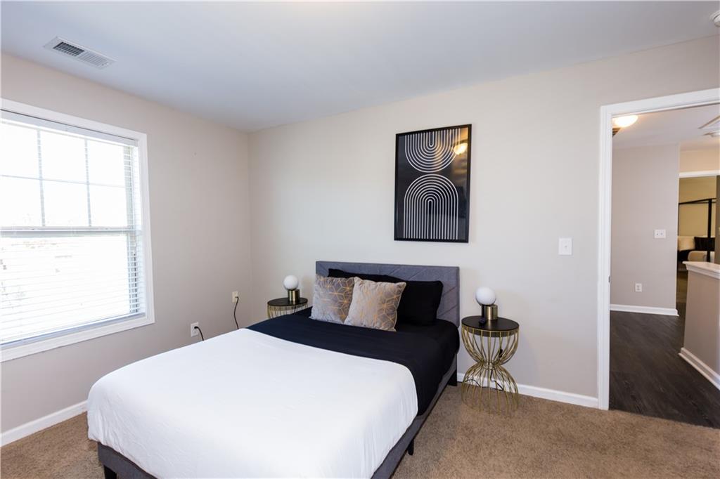 4245 Pear Haven Lane Gainesville, GA 30504 - Photo 33 of 39 a bedroom with a bed and window