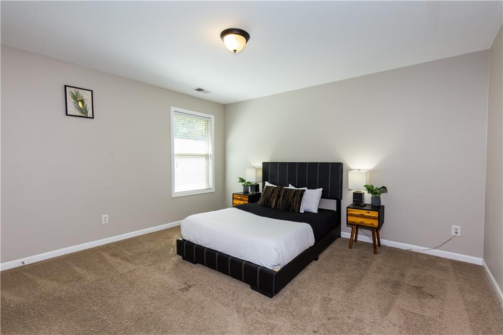 4245 Pear Haven Lane Gainesville, GA 30504 - Photo 34 of 39 a bedroom with a bed and window