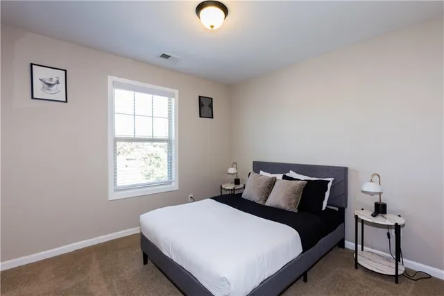 a bathroom with a sink a toilet a tub and shower