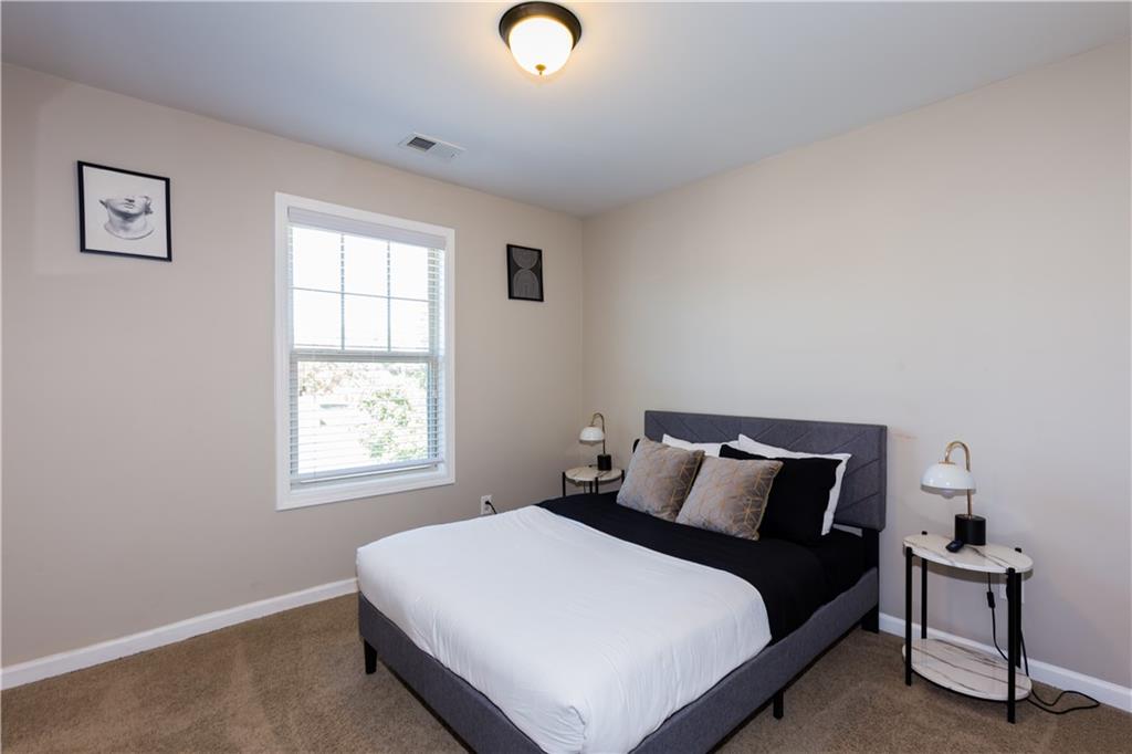 4245 Pear Haven Lane Gainesville, GA 30504 - Photo 37 of 39 a bedroom with a bed and window