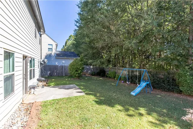 a view of a backyard with a slide