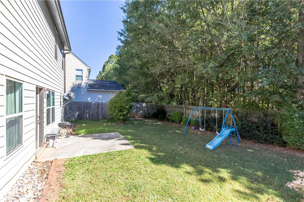 4245 Pear Haven Lane Gainesville, GA 30504 - Photo 5 of 39 a view of a backyard with a slide