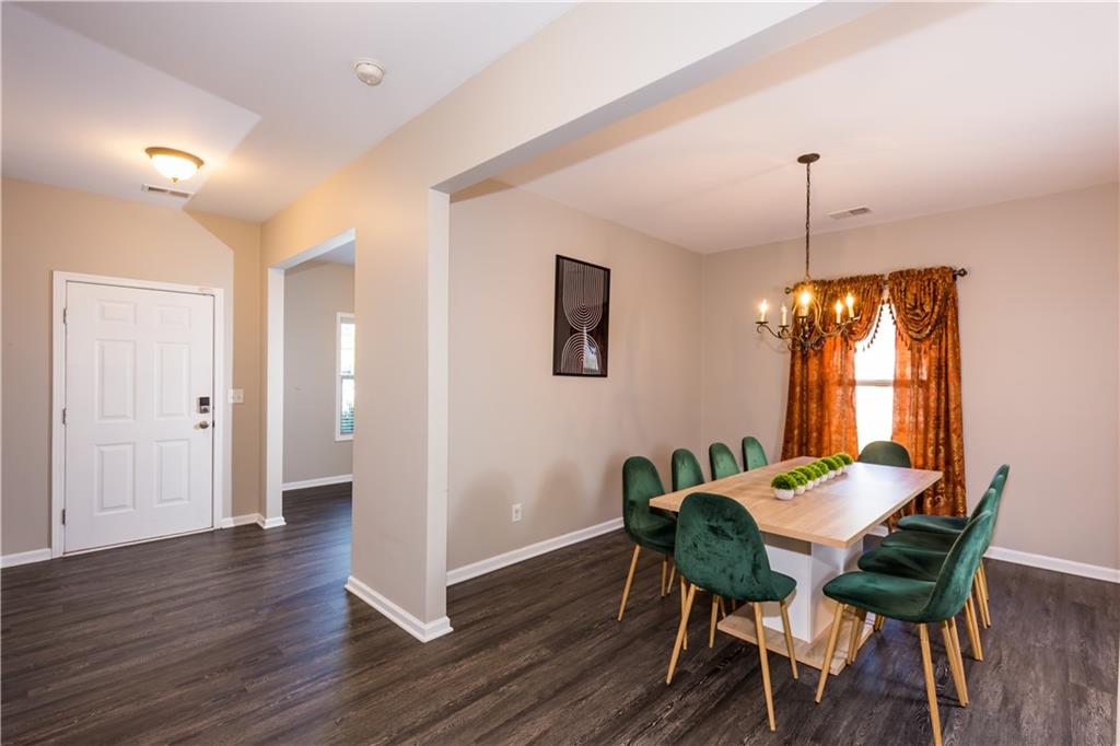 4245 Pear Haven Lane Gainesville, GA 30504 - Photo 7 of 39 a view of a dining room with furniture window and wooden floor