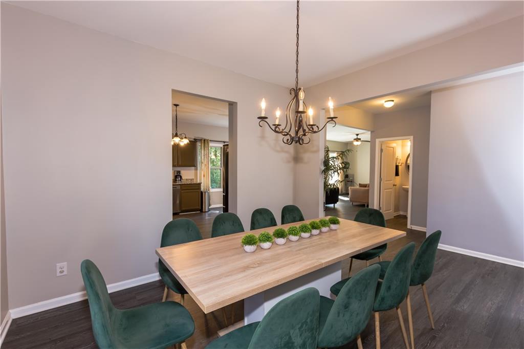 4245 Pear Haven Lane Gainesville, GA 30504 - Photo 10 of 39 a view of a dining room with furniture and wooden floor