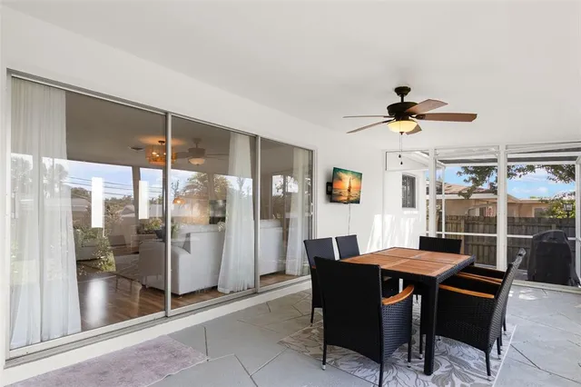 a dining room with furniture and window