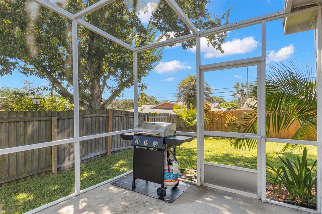 3488 Shady Bluff Drive Largo, FL 33770 - Photo 13 of 29 a view of a balcony with floor to ceiling windows and wooden fence