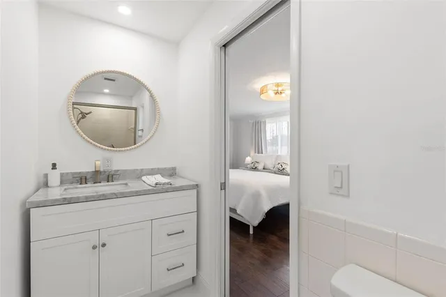 a en suite bathroom with a toilet sink and mirror