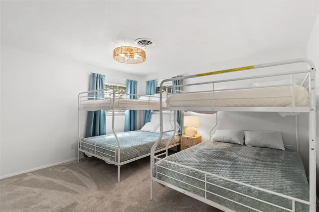 a bedroom with a bed and a table