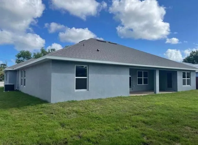 a backyard of a house with lots of green space