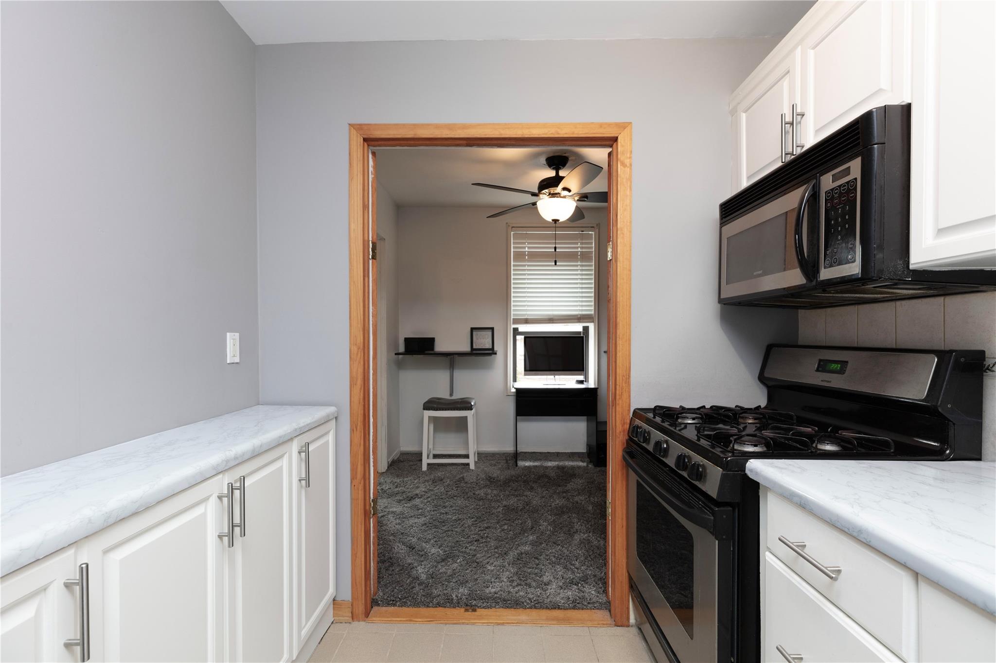 58-03 Calloway Street, Unit 3NN Queens, NY 11368 - Photo 12 of 23 a kitchen with a refrigerator stove and microwave