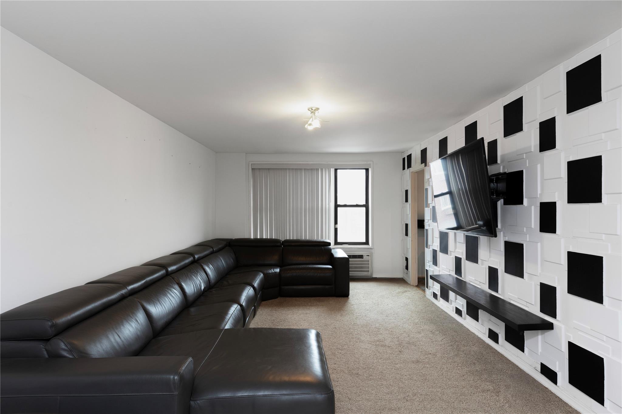 58-03 Calloway Street, Unit 3NN Queens, NY 11368 - Photo 8 of 23 a view of a livingroom with furniture and staircase