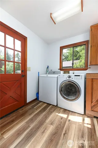 a view of a patio with a table chairs and a umbrella
