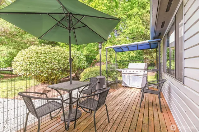 a living room with furniture a rug and a chandelier