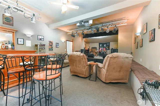 a view of a house with wooden fence