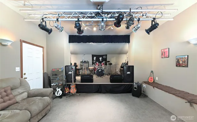 a bathroom with a toilet and shower curtain