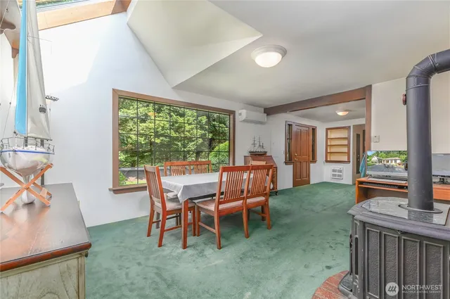 a dining room with furniture and window
