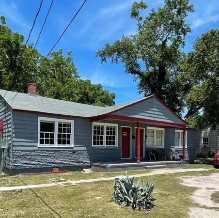 a view of a house with swimming pool and sitting area