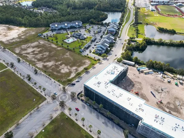 an aerial view of a house with a lake view