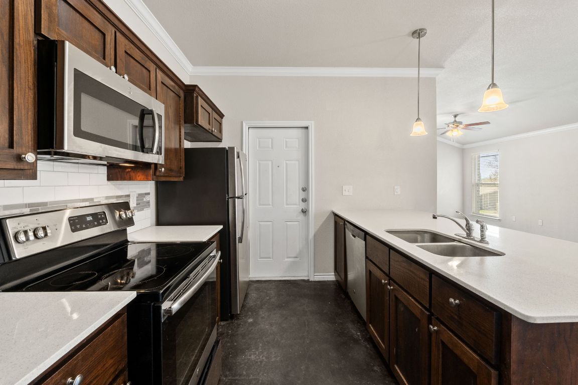 917 Ramblewood Street, Unit B Harker Heights, TX 76548 - Photo 10 of 39 a kitchen with a sink stove and microwave