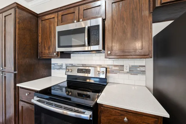 a kitchen that has a sink and a stove