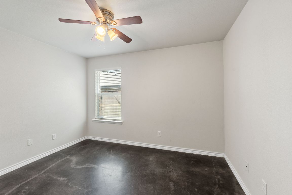 917 Ramblewood Street, Unit B Harker Heights, TX 76548 - Photo 16 of 39 an empty room with a window and a fan