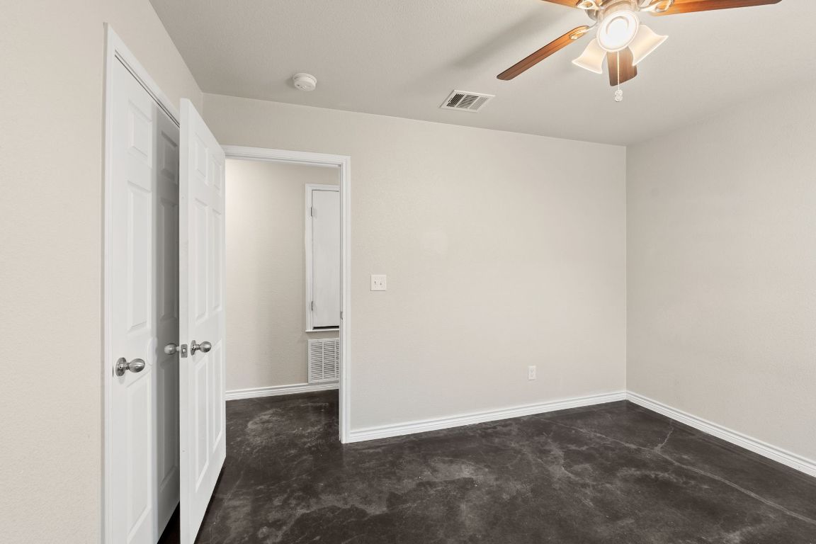 917 Ramblewood Street, Unit B Harker Heights, TX 76548 - Photo 19 of 39 an empty room with a ceiling fan and carpet