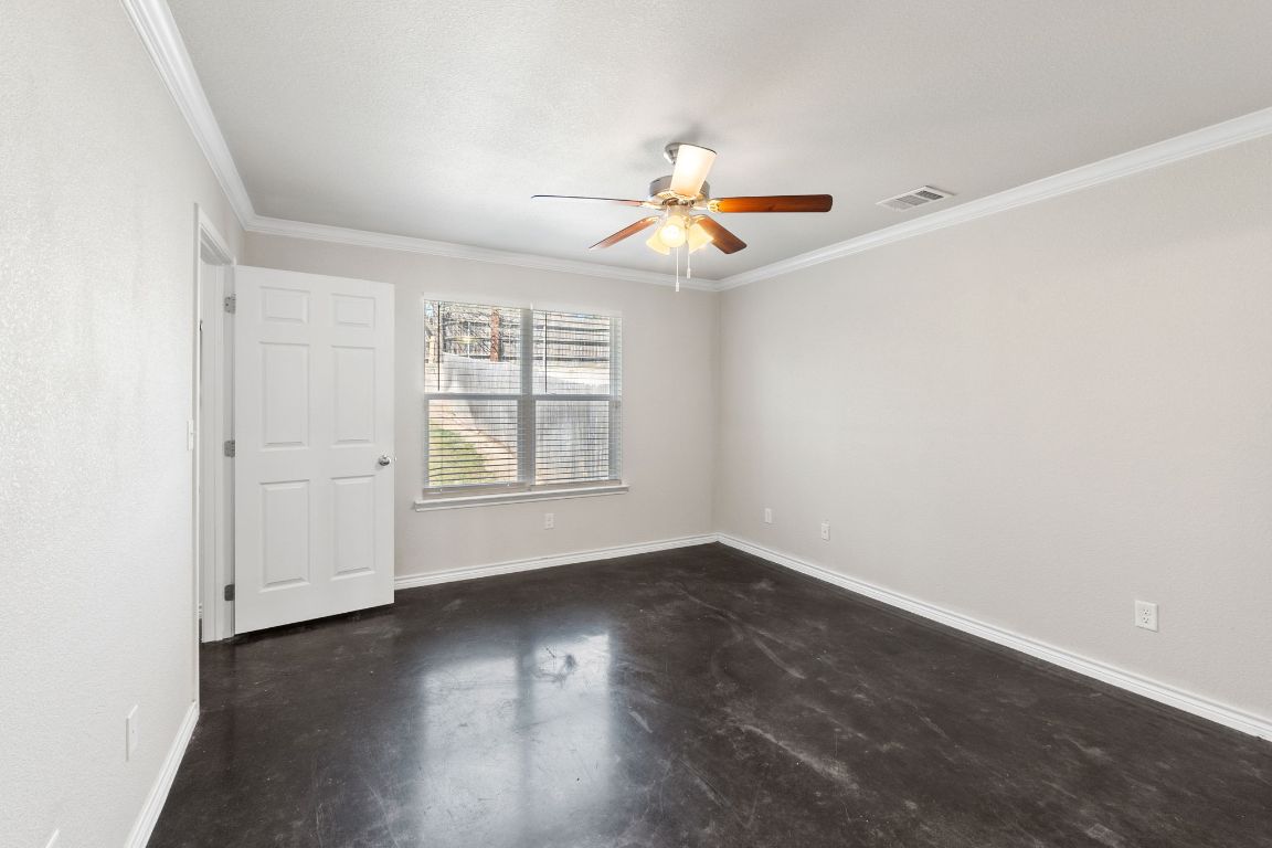 917 Ramblewood Street, Unit B Harker Heights, TX 76548 - Photo 22 of 39 an empty room with wooden floor and windows