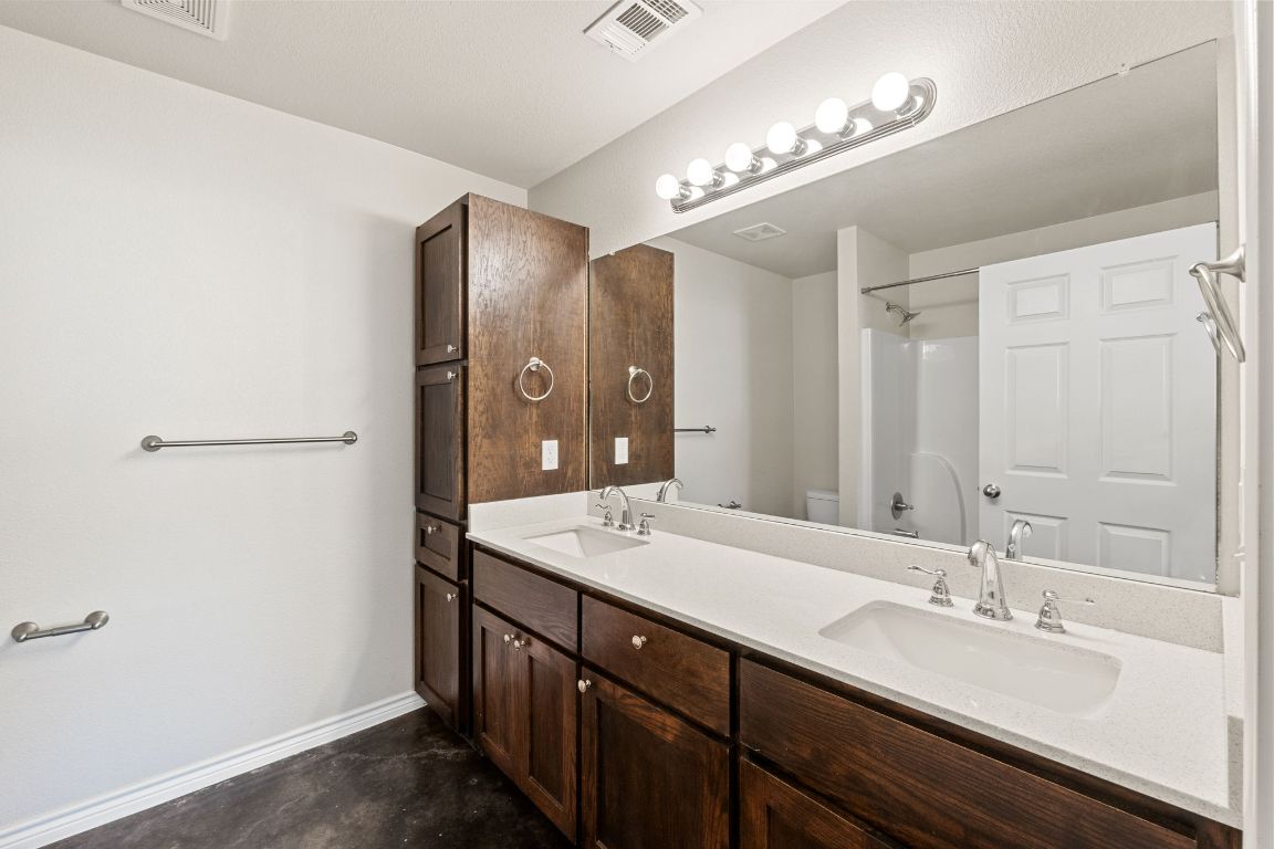 917 Ramblewood Street, Unit B Harker Heights, TX 76548 - Photo 27 of 39 a bathroom with a double vanity sink and a mirror