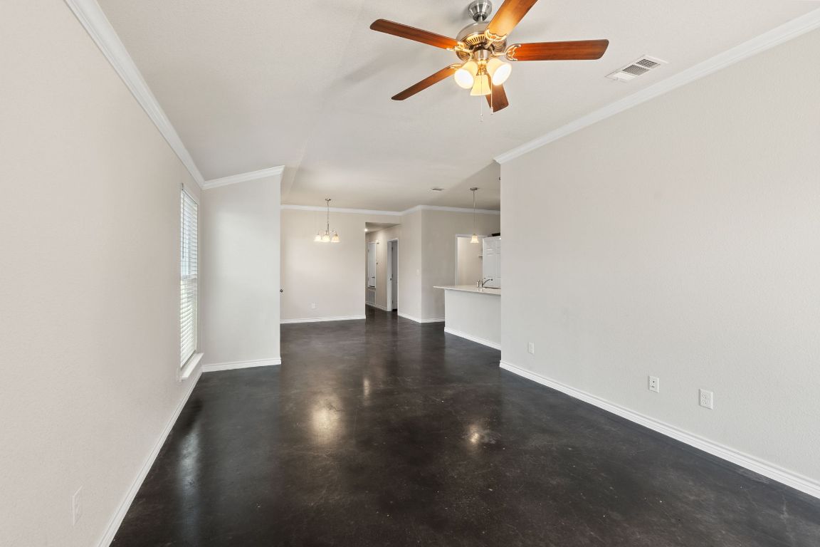 917 Ramblewood Street, Unit B Harker Heights, TX 76548 - Photo 6 of 39 an empty room with staircase and a ceiling fan