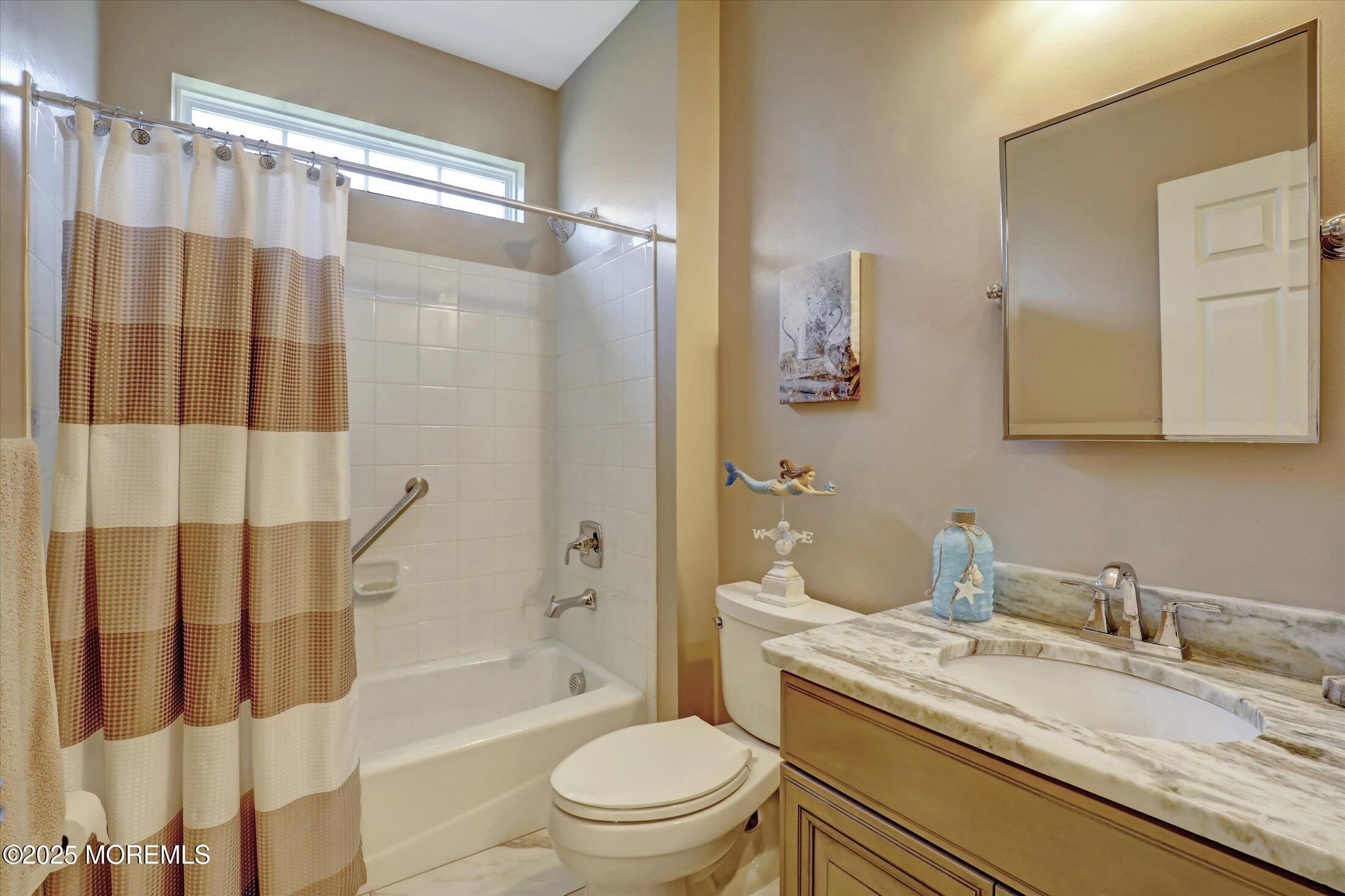 24 Moonlight Way Howell, NJ 07731 - Photo 26 of 34 a bathroom with a granite countertop sink toilet and shower