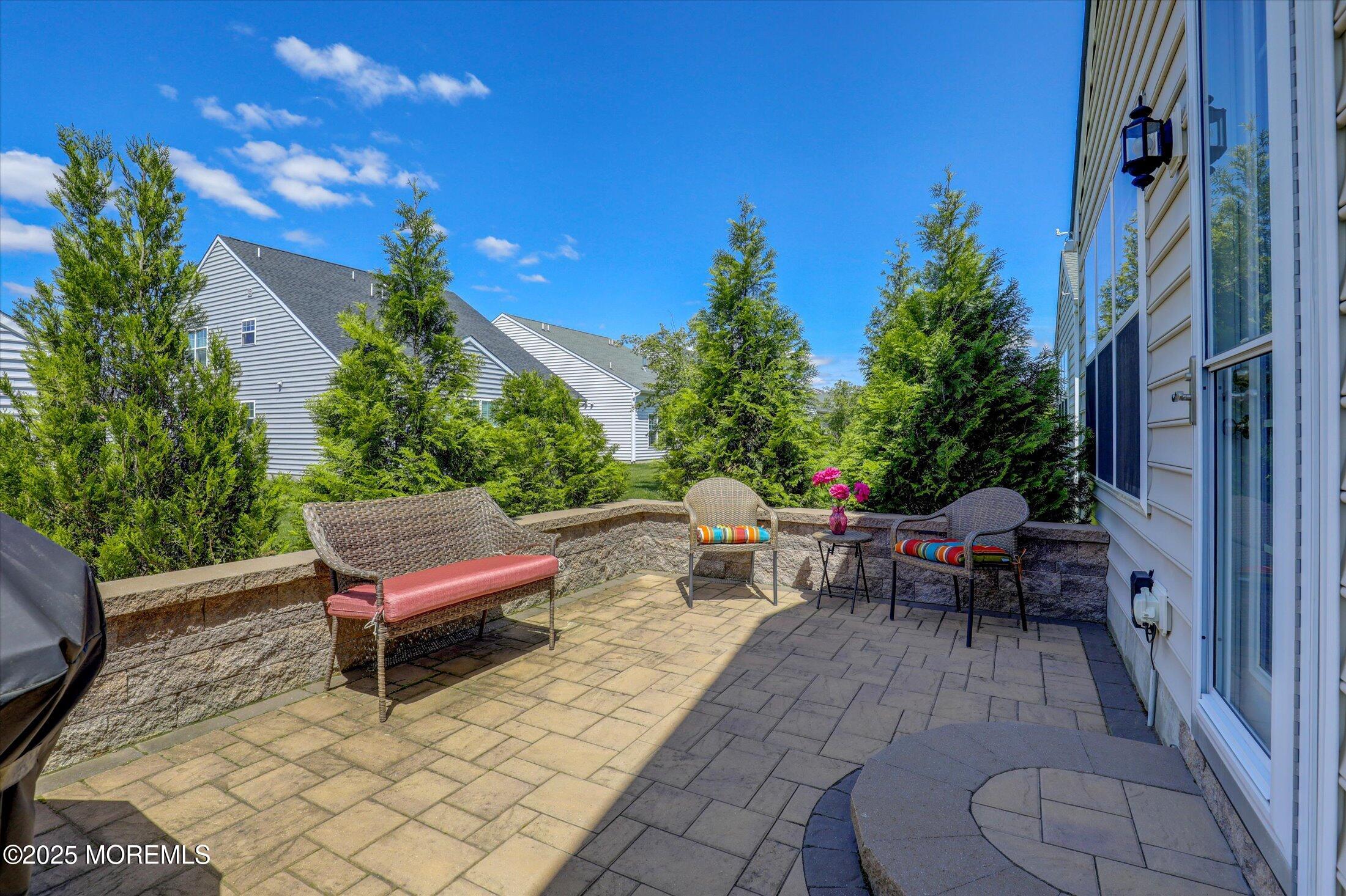 24 Moonlight Way Howell, NJ 07731 - Photo 28 of 34 a backyard of a house with outdoor seating
