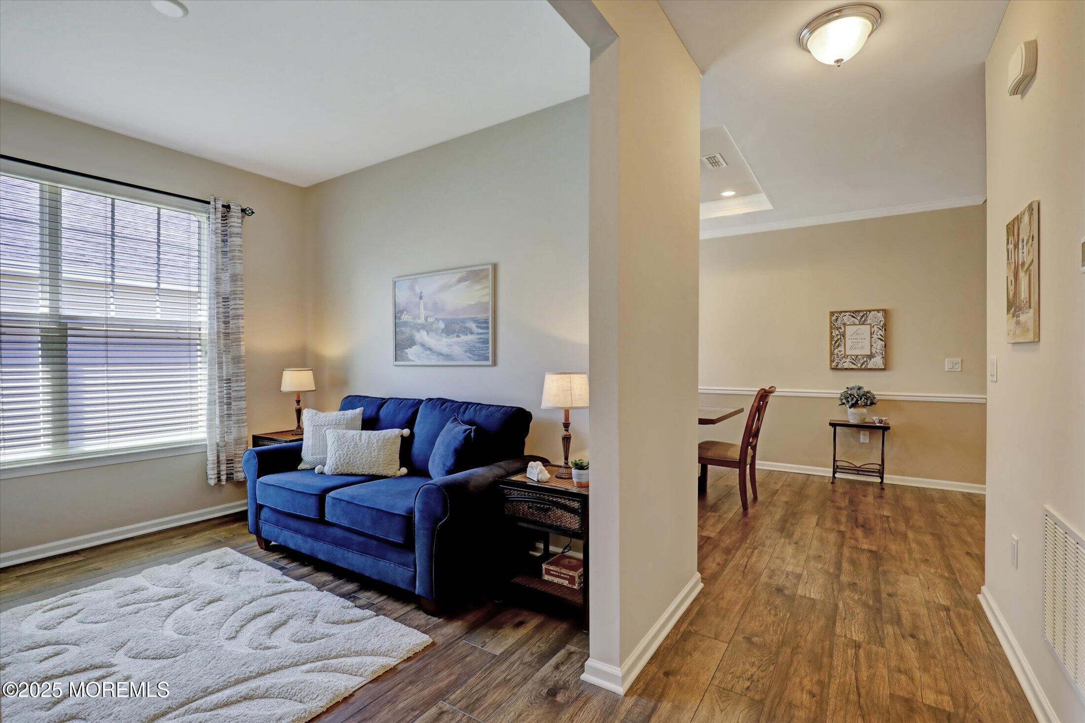 24 Moonlight Way Howell, NJ 07731 - Photo 6 of 34 a living room with furniture and a wooden floor