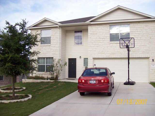149 Buttercup Way Kyle, TX 78640 - Photo 1 of 1 a car parked in front of a house