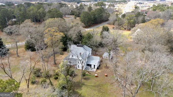 a aerial view of residential house with outdoor space