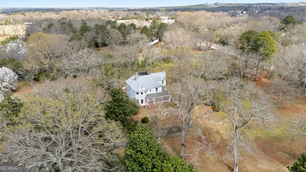 an aerial view of residential house with outdoor space