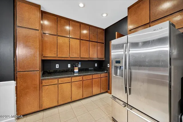 a kitchen with stainless steel appliances a refrigerator and a sink