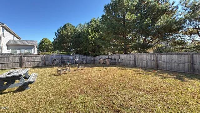 a swimming pool with wooden fence