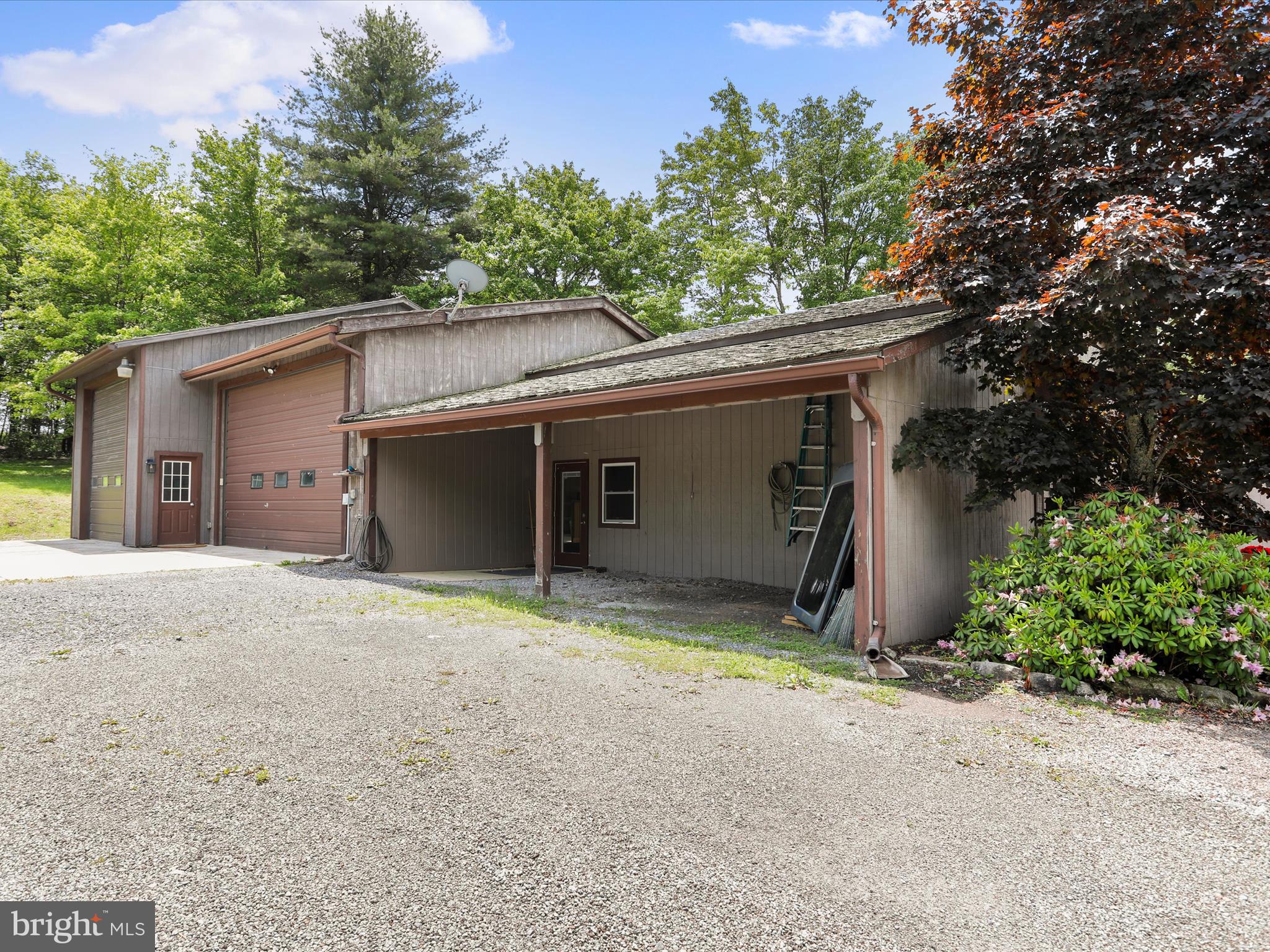 1240 Boy Scout Road Oakland, MD 21550 - Photo 95 of 148 a view of a house with a yard and garage