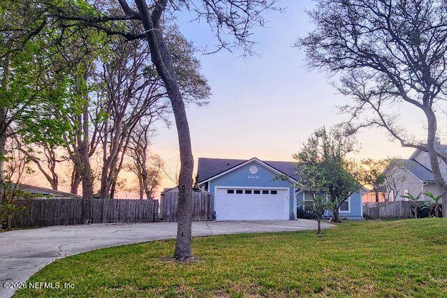 a house with a tree in front of it
