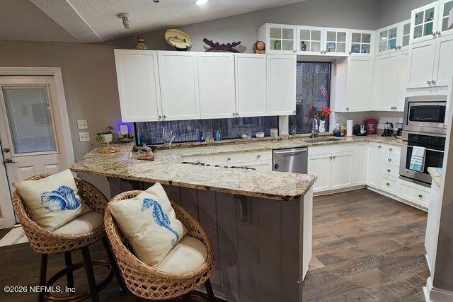 16039 Shellcracker Road Jacksonville, FL 32226 - Photo 12 of 39 a kitchen with a sink cabinets and window