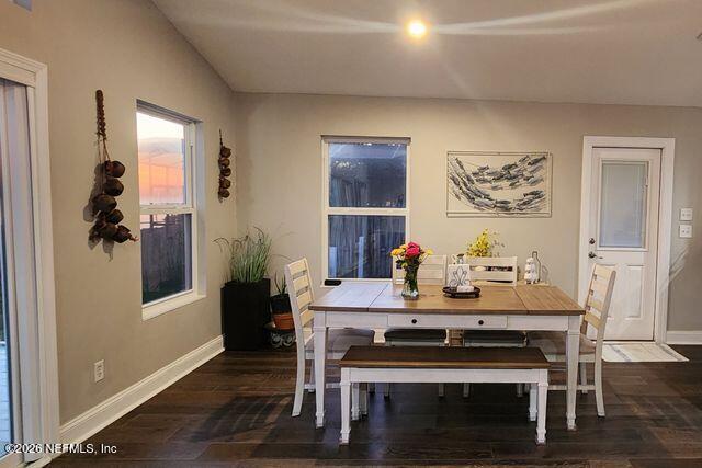 16039 Shellcracker Road Jacksonville, FL 32226 - Photo 15 of 39 a view of a dining room with furniture and wooden floor
