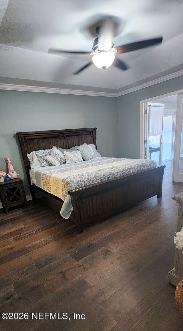 16039 Shellcracker Road Jacksonville, FL 32226 - Photo 23 of 39 a bedroom with a bed and a chandelier