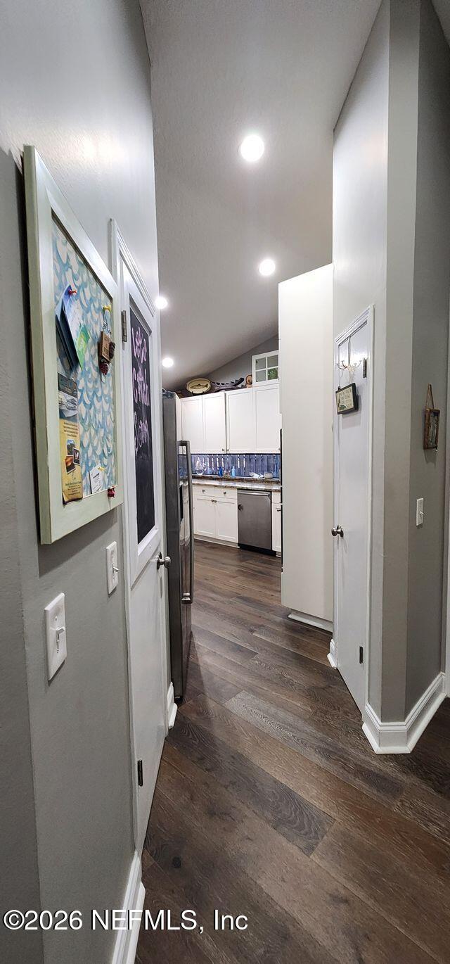 16039 Shellcracker Road Jacksonville, FL 32226 - Photo 8 of 39 a view of a hallway with wooden floor
