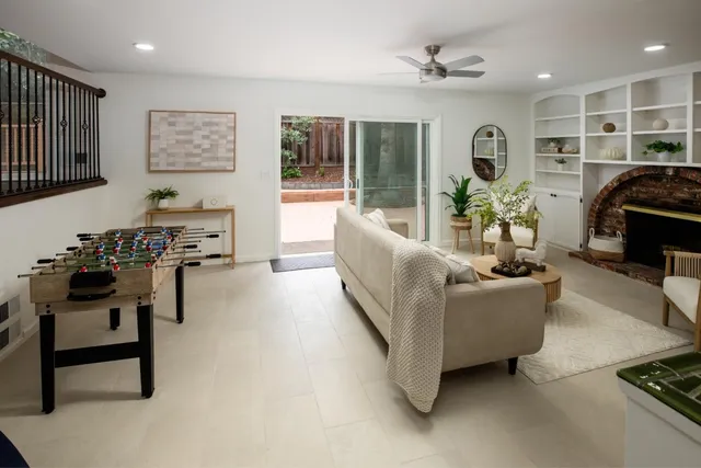 a living room with furniture and a table